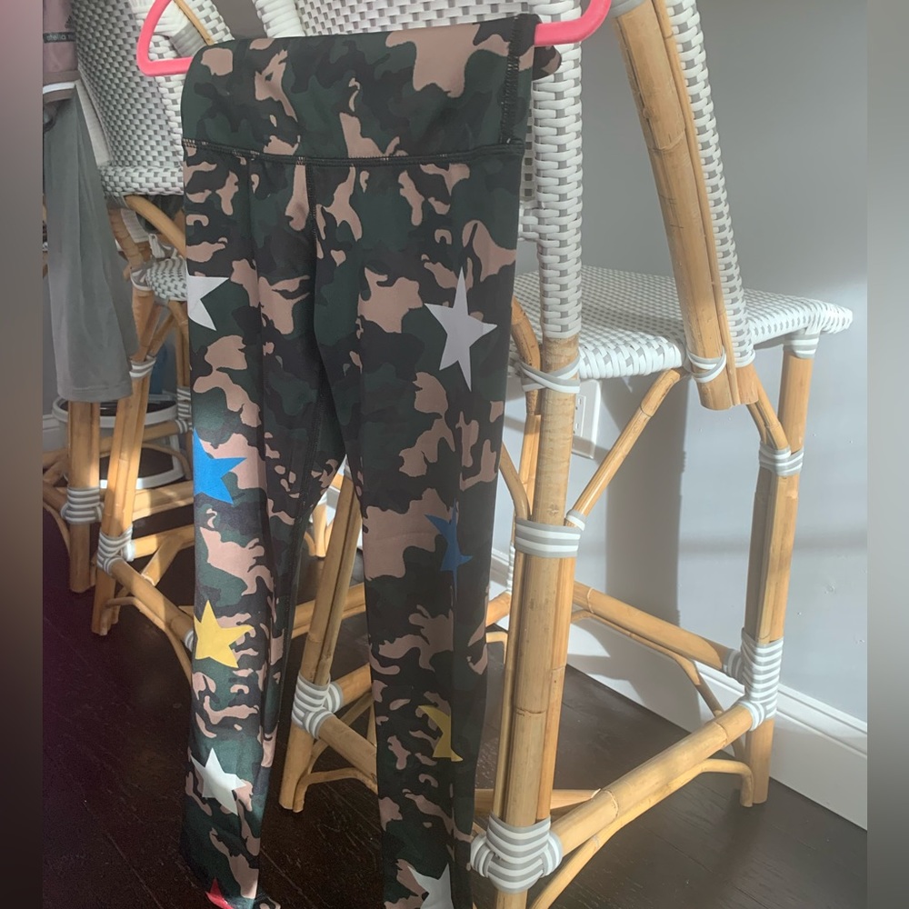 Green leggings with multicolor stars